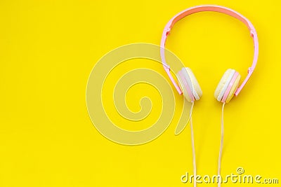 Top view new pink music headphone on yellow backgrounddesign Stock Photo