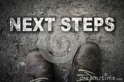 Top View of Next Steps text with the boot Stock Photo