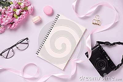 Top view note book anf flowers on the desktop. For wedding planner concept Stock Photo