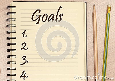 Top view notebook write message Goals and number list with pencil on table Stock Photo