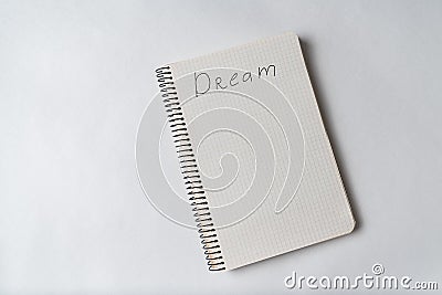 Top view of notepad with inscription Dream. Motivational note. Wish list Stock Photo