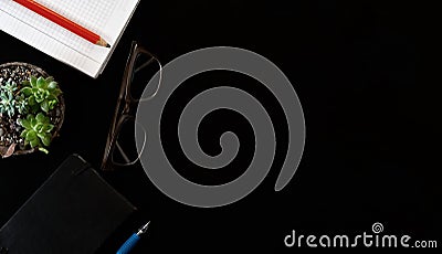 Top view of notepads for taking notes, glasses for sight, top view with copy space. Workspace concept Stock Photo