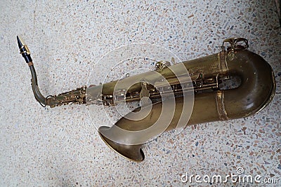 Top view, old golden saxophone instrument, vintage jazz instrument. Stock Photo