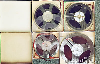 Top view of old sound recording tape, reel to reel type and box. Stock Photo