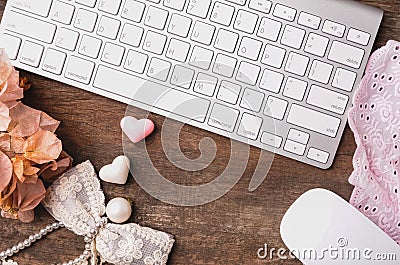 Top view of old wooden working table with decoration, computer k Stock Photo