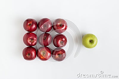 Top view of one green apple among red apples Stock Photo