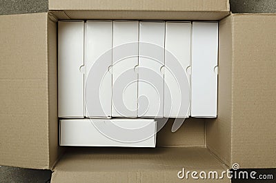 Top view of opened box and many white boxes in it Stock Photo
