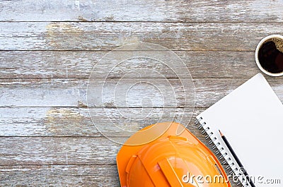 Top view with orange safety engineer helmet and blank notebook o Stock Photo