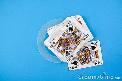Top view of a pack of playing cards isolated on a blue background Stock Photo