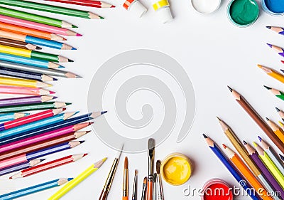 Top view of paint brushes, color pencils and watercolors Stock Photo