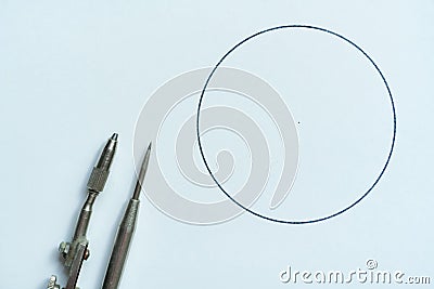 the top view of the pair of compasses on the surface to make a sketch with circle Stock Photo