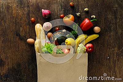 Top view paper bag different health food wooden background Stock Photo