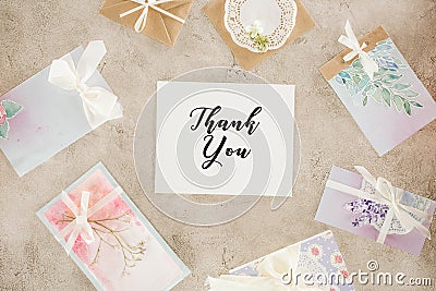top view of paper with lettering surrounded with greeting cards Stock Photo
