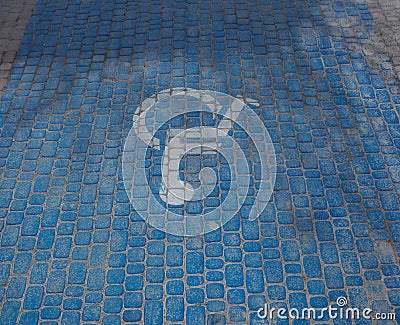 Top view on parking sign for disable people. Disabled parking space and wheelchair symbols on pavement Stock Photo