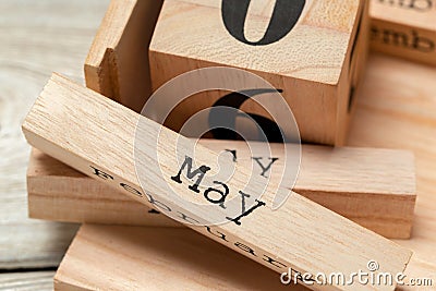 Top view of parts of wooden calendar on dark wooden tabletop Stock Photo