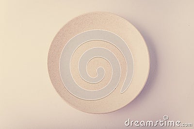 Top view of a pastel plate on a pastel peach background. Minimalism food photography. Geometric style. Stock Photo