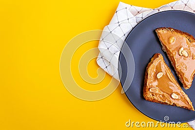 Top view. Peanut butter toasts on plate Stock Photo