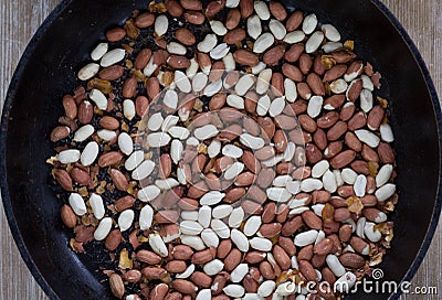 Top view of peanut with seed coat frying on the pan Stock Photo