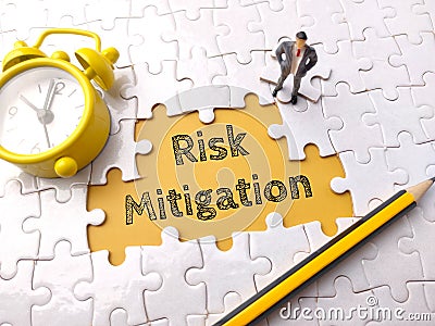 Top view pencil,clock and miniature people with text Risk Mitigation Stock Photo