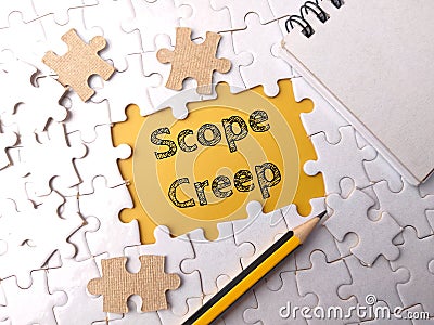 Top view pencil and notebook with text Scope Creep Stock Photo