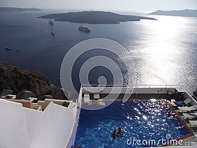 Top view of people in the pool in Santorini, Greece - holiday concept Editorial Stock Photo