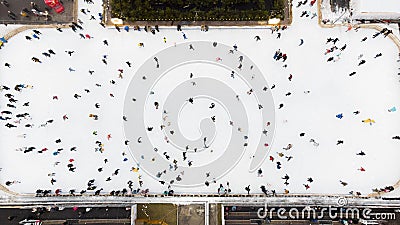 Top view of people skating on open air ice rink on winter day New Year Christmas Editorial Stock Photo