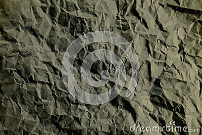 Top view photo of Crumpled craft paper. Grey color Paper background with copyspace. Vintage paper canvas texture abstract Stock Photo
