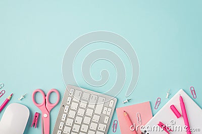 Top view photo of pink stationery pen pencils scissors pins clips sticker organizer keyboard and mouse on isolated pastel blue Stock Photo