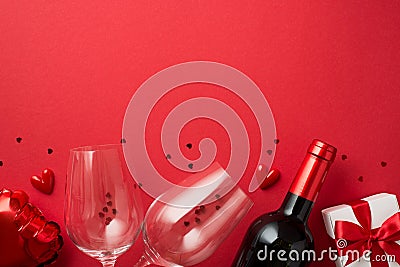 Top view photo of valentine`s day decorations gift box heart shaped balloon small hearts two wineglasses wine bottle and red Stock Photo