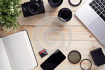 Top view of photographer desk with latptop, camera and lenses with copy space Stock Photo