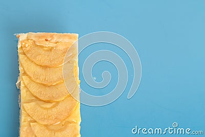 Top view of a piece of apple pie on a blue surface Stock Photo