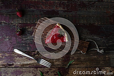 top view of piece of strawberry pie and fork Stock Photo