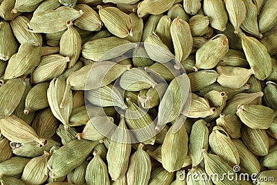 Top view on a pile of dry scattered unrefined cardamom seeds Stock Photo