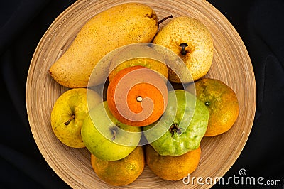 Top view pile of ripe fresh guava frui, red tomato, oranges, pear and apples Stock Photo