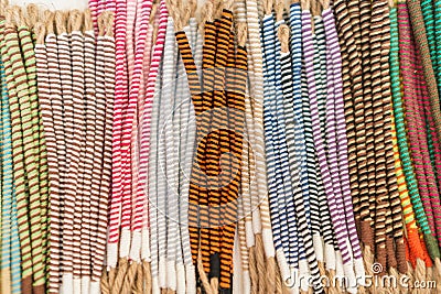 Top view of a pile of striped bracelets creates a colorful background Stock Photo