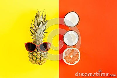 Pineapple sunglasses grapefruit coconut colorful background Flat Stock Photo