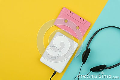 Top view of a pink audio cassette tape with a white portable cassette player Stock Photo