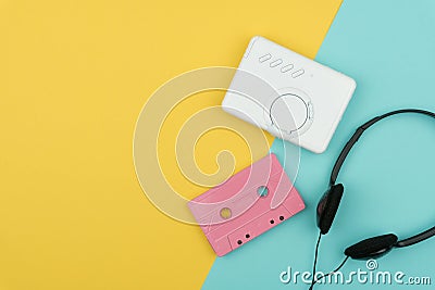 A pink audio cassette tape with a white portable cassette player Stock Photo