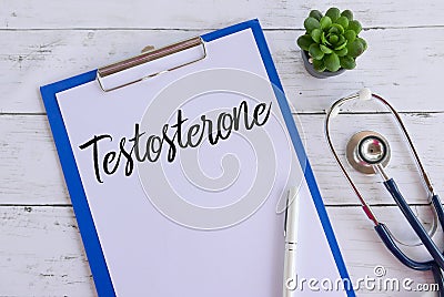 Top view of plant,stethoscope,pen,clipboard and paper written with Testosterone. Healthcare and medical concept. Stock Photo