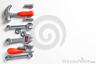 Top view. Plastic mechanic children Tool flat lay background. Space for text design. Mechanic Tools toy on white background Stock Photo