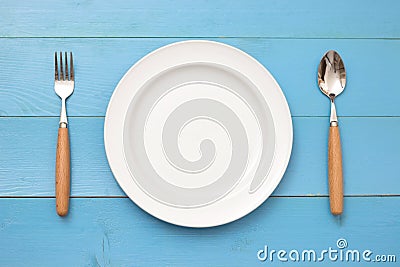 Top view of plate, fork and spoon Stock Photo