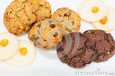 Top view of a plate of oatmeal chocolate, shortbread cookies on a white background Stock Photo