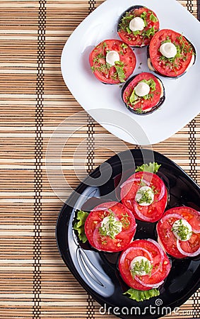 Top view of a plate of stewed eggplant and red tomatoes Stock Photo