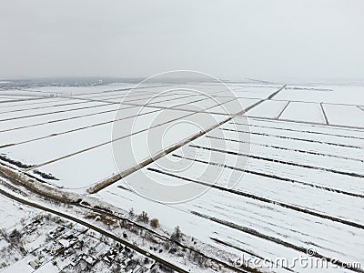 Top view of a plowed field in winter. A field of wheat in the snow Stock Photo