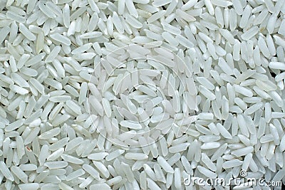 Top view of polished long raw rice background. Organic, natural white rice seed texture Stock Photo