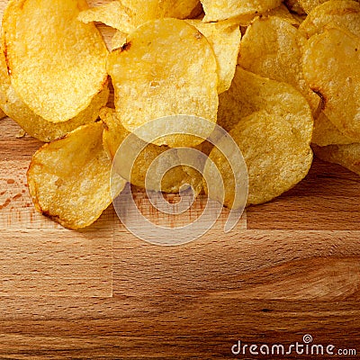 Top view potato chips over wooden table Stock Photo