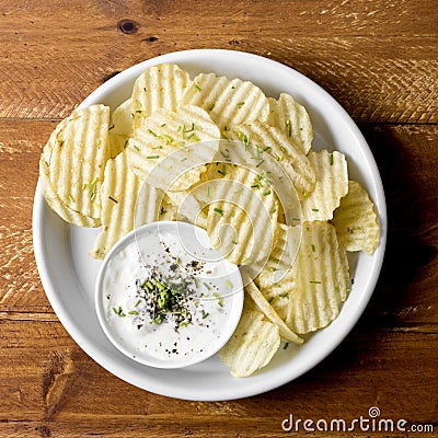 top view potato chips plate with sauce. High quality photo Stock Photo