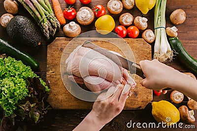 Preparing cooking process with poultry and season vegetables Stock Photo