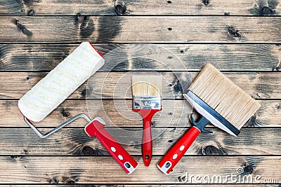 Professional house painter, work tools on wooden background Stock Photo