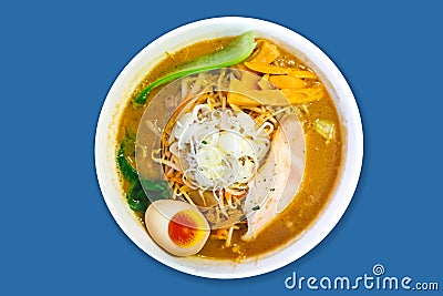 Top view of Ramen Pork Bone Soup Tonkotsu Ramen with Chashu Pork, Scallion, Sprout, Carrot, Menma Seasoned Bamboo Shoots. Stock Photo